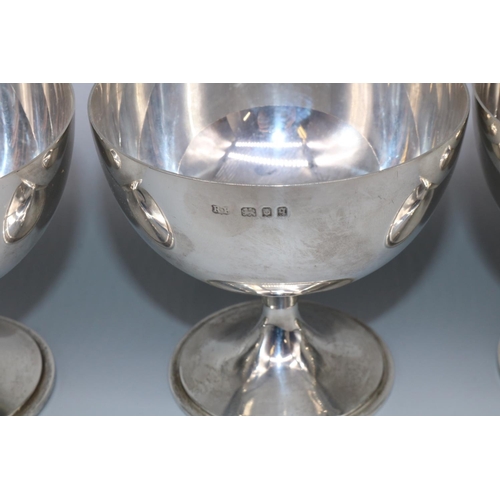 1054 - Harlequin set of four George V-V1 hallmarked silver pedestal grapefruit dishes, on circular tapering... 