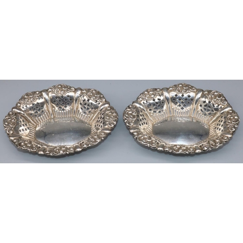 1088 - Pair of Victorian hallmarked silver oval pierced bon bon dishes with scroll borders, by Miller Broth... 