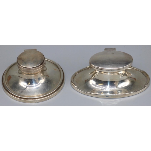 1079 - George V hallmarked silver Art Deco oval capstan inkwell, with hinged cover on stepped base, maker u... 