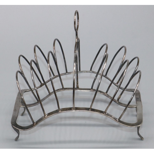 1073 - George 111 hallmarked silver wirework seven bar toast rack, with loop handle on shaped base with fou... 