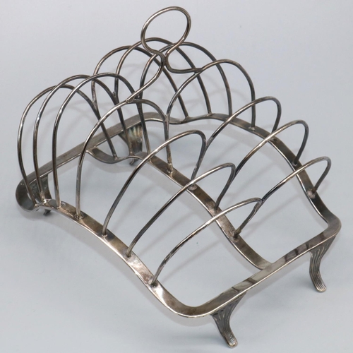 1073 - George 111 hallmarked silver wirework seven bar toast rack, with loop handle on shaped base with fou... 