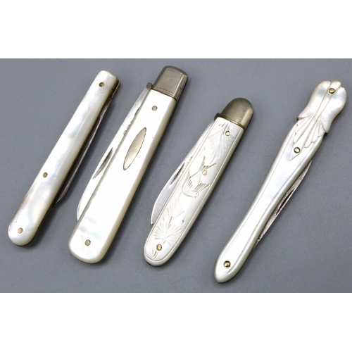 1082 - Two George V hallmarked silver folding soft fruit knives with mother of pearl handles, Harrison Fish... 