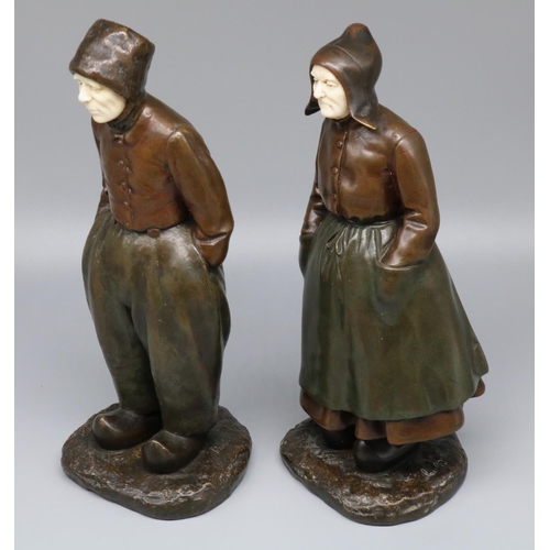 1101 - Paul D'Aire (French early C20th); Pair of green and brown patinated bronze and ivory figures of Dutc... 