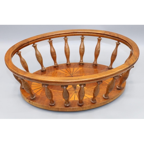 1116 - Early C20th wooden oval openwork bread basket, base inlaid with fan and star and with baluster turne... 