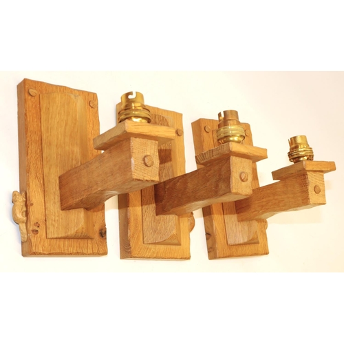 1366 - Colin Beaverman Almack of Sutton-under-Whitestonecliffe - a set of three oak wall light fittings, wi... 