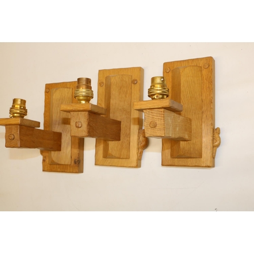 1366 - Colin Beaverman Almack of Sutton-under-Whitestonecliffe - a set of three oak wall light fittings, wi... 