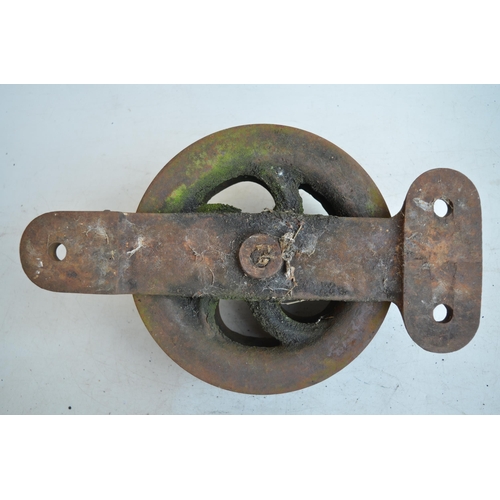 24 - Heavy cast iron double pulley, marked BD.