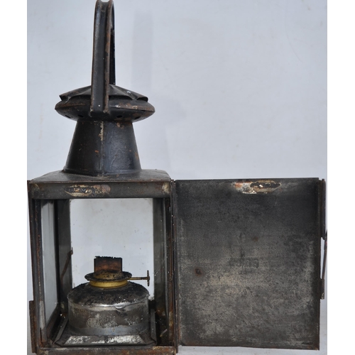 35 - Three vintage railway lamps to include LMS and BR(M) stamped examples, larger signal lamp has no mar... 