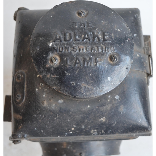 38 - Two vintage Adlake Non Sweating railway lamp, larger version with no internals, both in need of rest... 