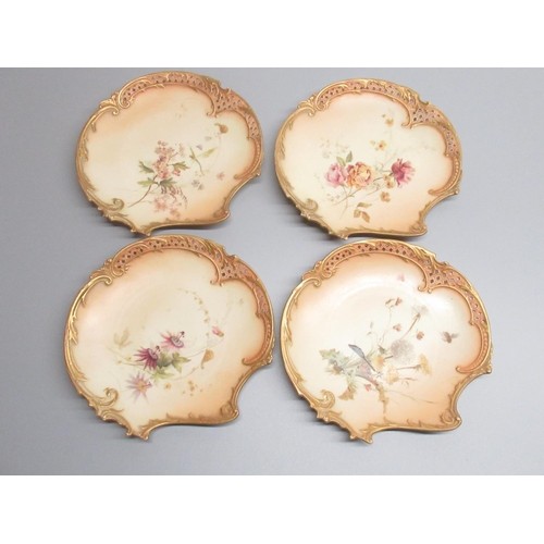 1131 - Nine Royal Worcester scallop shaped dessert plates, painted with flowers butterflies and other winge... 