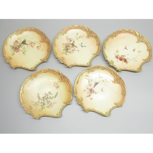 1131 - Nine Royal Worcester scallop shaped dessert plates, painted with flowers butterflies and other winge... 