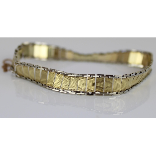 1025 - 14ct yellow and white gold articulated bracelet with box clasp and safety chain, stamped 585, 8.6g
