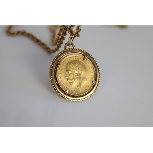 1017 - Geo.V 1928 sovereign in 9ct yellow gold mount, stamped 375, on 9ct yellow gold rope twist chain, sta... 