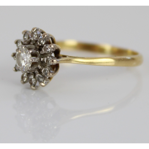 1027 - 18ct yellow gold diamond floral cluster ring, the large central diamond surrounded by a halo of marq... 