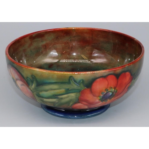 1149 - Moorcroft Pottery: Anemone pattern footed bowl, tubelined decoration of red and orange flowers on a ... 