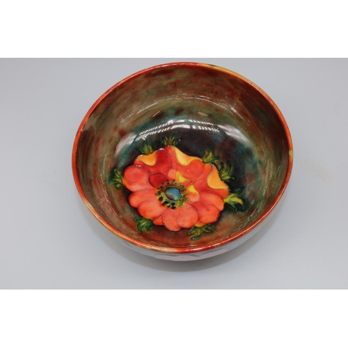 1149 - Moorcroft Pottery: Anemone pattern footed bowl, tubelined decoration of red and orange flowers on a ... 