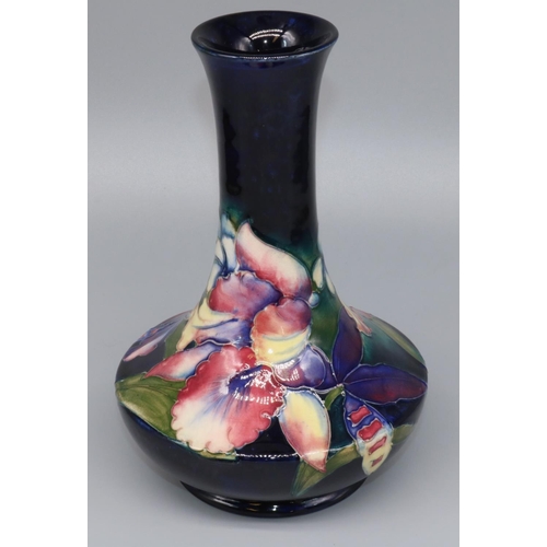 1148 - Moorcroft Pottery: Orchid pattern vase, compressed form with waisted neck, tubelined decoration of p... 