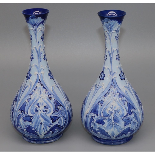 1138 - William Moorcroft for James Macintyre & Co: pair of Iris pattern vases, tubelined floral decoration ... 