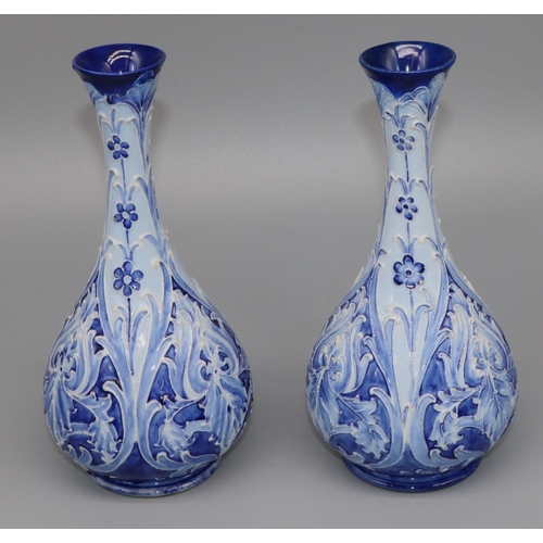 1138 - William Moorcroft for James Macintyre & Co: pair of Iris pattern vases, tubelined floral decoration ... 