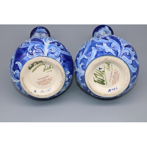 1138 - William Moorcroft for James Macintyre & Co: pair of Iris pattern vases, tubelined floral decoration ... 