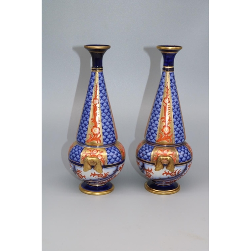 1140 - William Moorcroft for James Macintyre & Co: pair of twin handled Aurelian design vases, printed mark... 