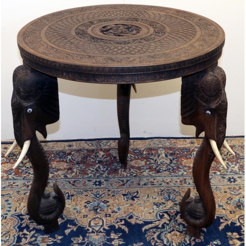 1341 - C20th Indian hardwood occasional table, circular top carved with figures in geometric and floral scr... 