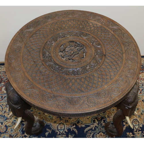 1341 - C20th Indian hardwood occasional table, circular top carved with figures in geometric and floral scr... 