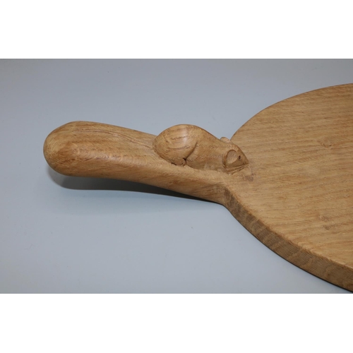 1368 - Robert Mouseman Thompson of Kilburn - an adzed oak oval cheese board, curved handle carved with sign... 