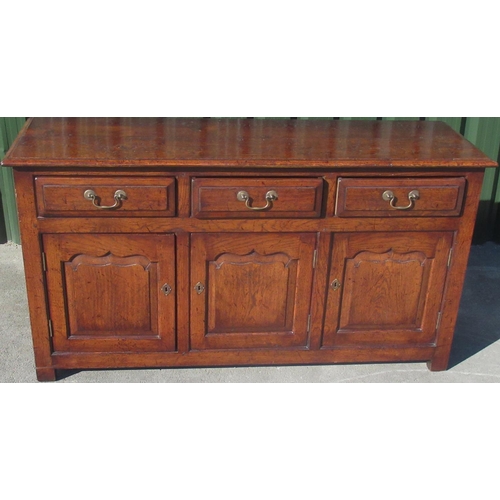 1312 - C18th style oak dresser, moulded top above three fielded panel drawers and three similar doors, on s... 