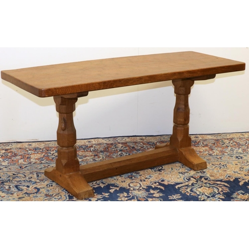 1361 - Robert Mouseman Thompson of Kilburn - an oak coffee table, rectangular adzed top on octagonal balust... 