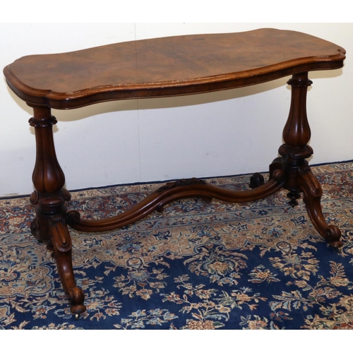 1331 - Victorian figured walnut centre table, quarter veneered shaped oval top on lobed baluster supports w... 