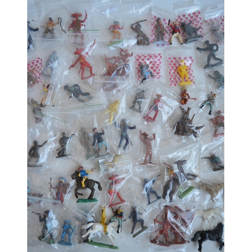 295 - Extensive collection of plastic toy figures, mostly Cowboys and Indians to include Timpo, Britain's ... 