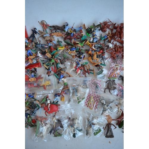 295 - Extensive collection of plastic toy figures, mostly Cowboys and Indians to include Timpo, Britain's ... 