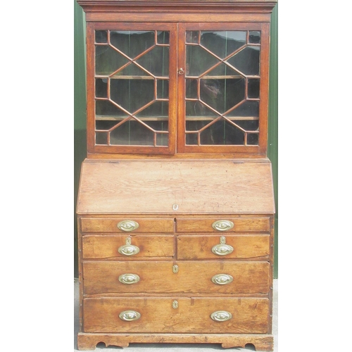 1329 - George 111 Country made oak bureau bookcase, with moulded cornice and astragal glazed doors above a ... 