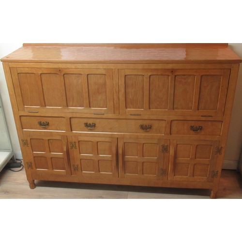 1360 - Derek Fishman Slater of Crayke - an panelled adzed oak side cabinet with two fall fronts, three draw... 