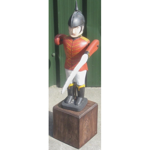 1317 - Folk Art style Soldier Whirlygig, painted with red jacket and black helmet, on oak base, H86cm