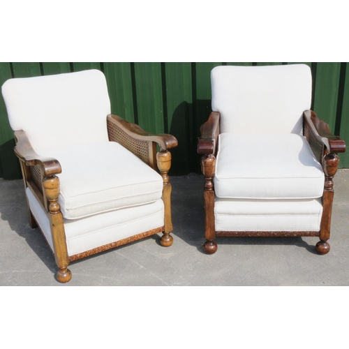 1326 - Pair of arm chairs, scroll arms with canework panels, with loose seat cushion upholstered in self pa... 