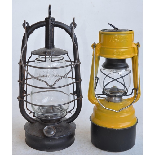 59 - Two vintage German paraffin storm lamps to include a Bat lamp (metal body stamped Made In Thuringia,... 