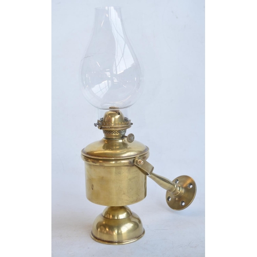 61 - Attractive vintage brass ships wall mounted light with single plane gimble. Burner wick adjustment w... 