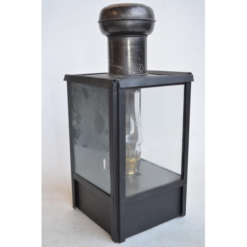 65 - World War II British blackout oil lantern (missing sloped side light inhibitor panels), a similarly ... 