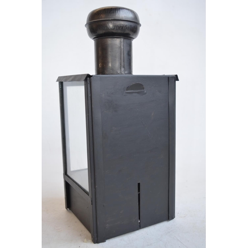 65 - World War II British blackout oil lantern (missing sloped side light inhibitor panels), a similarly ... 