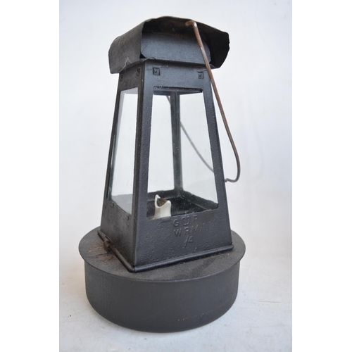 65 - World War II British blackout oil lantern (missing sloped side light inhibitor panels), a similarly ... 