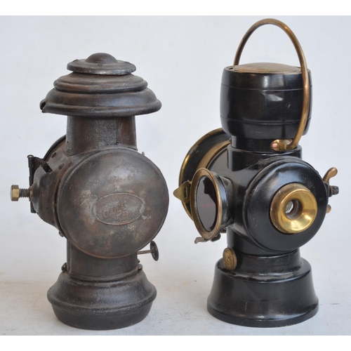 70 - A pair of vintage oil burning vehicle lamps to include a British made Lucas No 633 