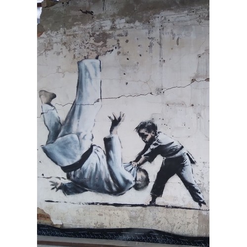 6 - Name: Andy Davis,

Title: Banksy in Borodyanka, Ukraine,

Size: A4 photo print on Foamex,

Bio: This... 