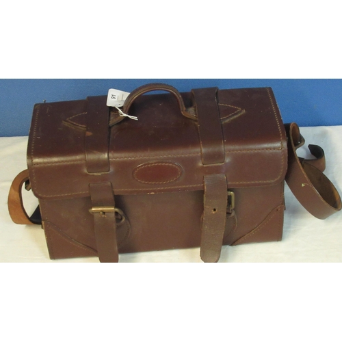 91 - Leather cartridge case with hinged lid, carrying handle and shoulder strap. 34cm x 200cm x 14cm