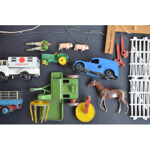 302 - Two Pelham Puppets, a collection of vintage diecast vehicles from Dinky, Chad Valley and Tri-Ang and... 