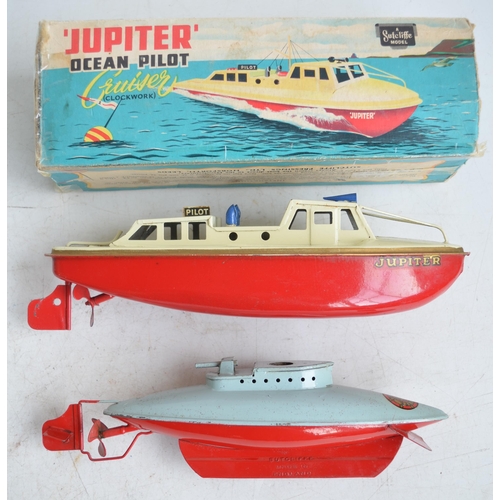 306 - Two vintage Sutcliffe Models clockwork tinplate boat models to include a boxed 