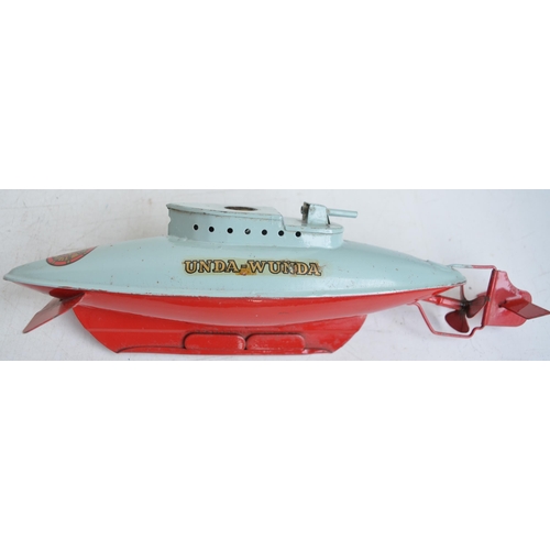 306 - Two vintage Sutcliffe Models clockwork tinplate boat models to include a boxed 