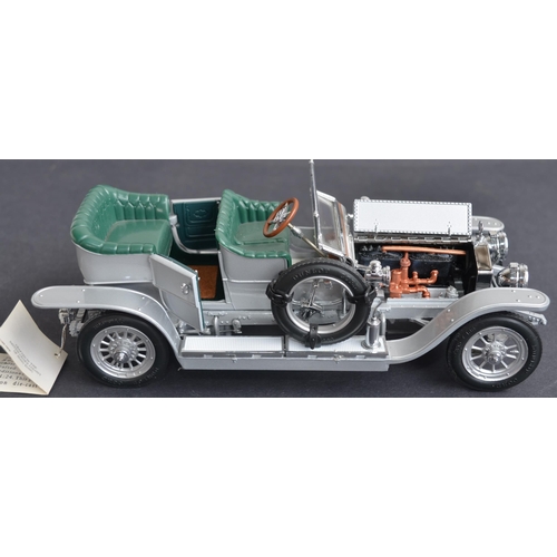 310 - Two boxed 1/24 scale diecast Rolls Royce models to include a Franklin Mint 1907 Silver Ghost (mint c... 