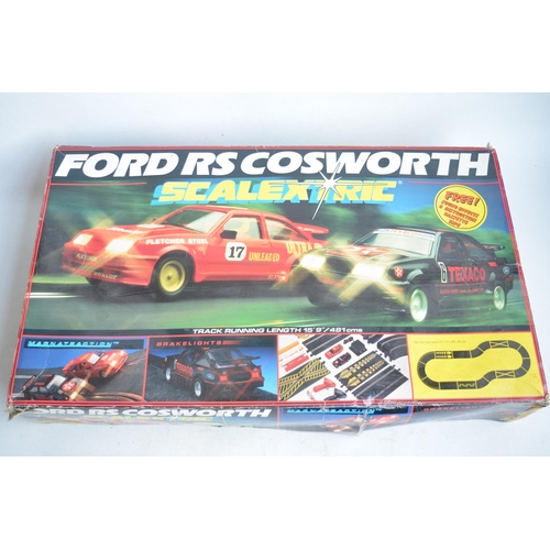 341 - Boxed Scalextric Ford Cosworth racing set and a collection of used track and other spare accessories